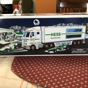 Here is a Hess Truck with two racing cars